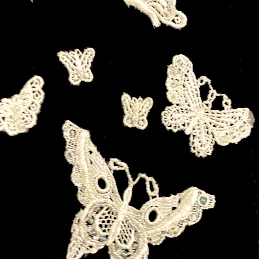 Beautiful black sweater with butterfly appliqués!